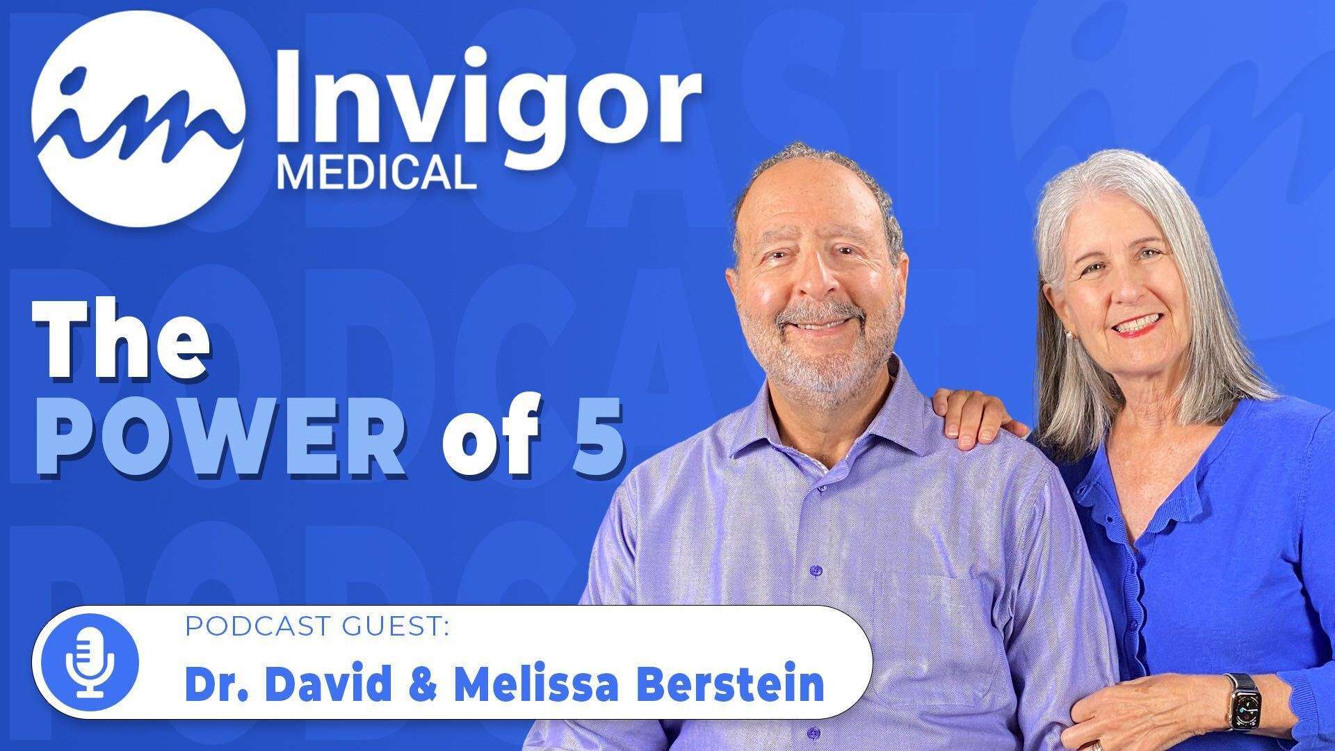A smiling man and woman stand together in front of a blue backdrop featuring the Invigor Medical logo and “The Power of 5,” highlighting their appearance as podcast guests, Dr. David & Melissa Bernstein.