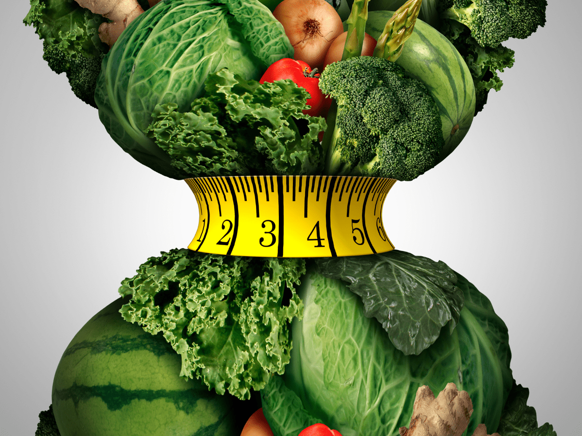 Green leafy vegetables and a tape measure