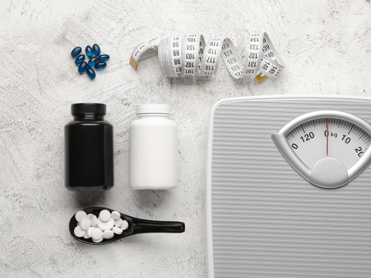 Pills, tape measure and scale