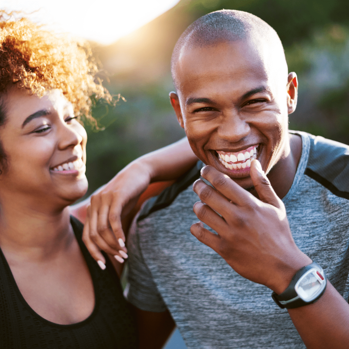 A man and woman smiling