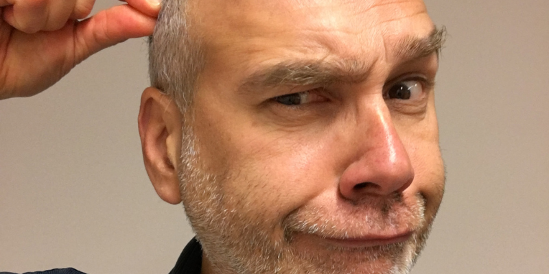 man with balding and gray hair