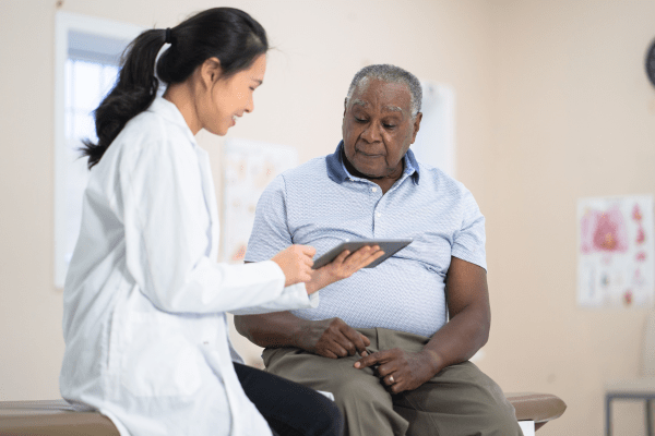 A man talking with his doctor about What To Expect When You Take Viagra