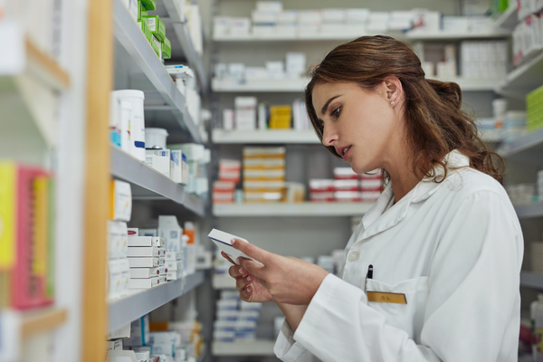 a pharmacist looking at drug interactions