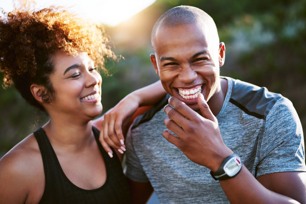 man and woman smiling