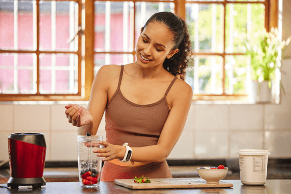 a woman making an antioxidant smoothie