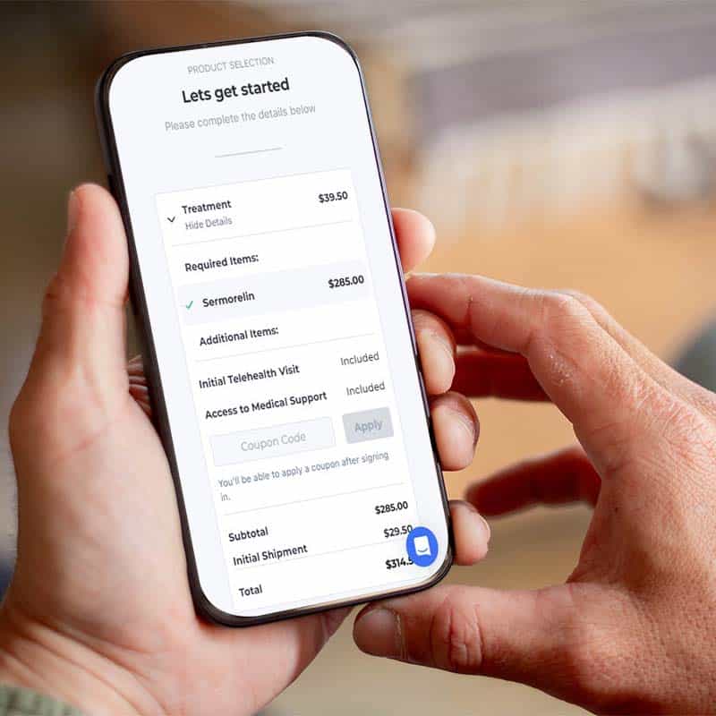 Hand holding a phone with a telehealth sign-up
