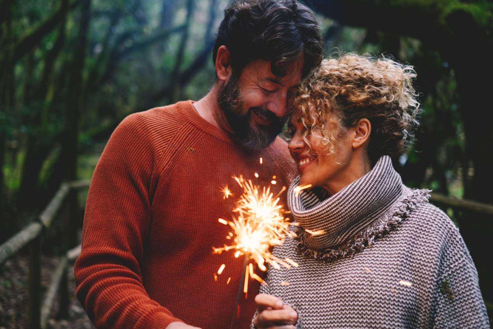 A couple looking at a sparkler