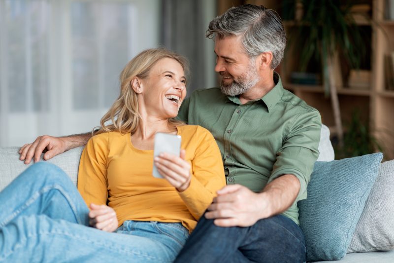 A middle aged couple on the couch