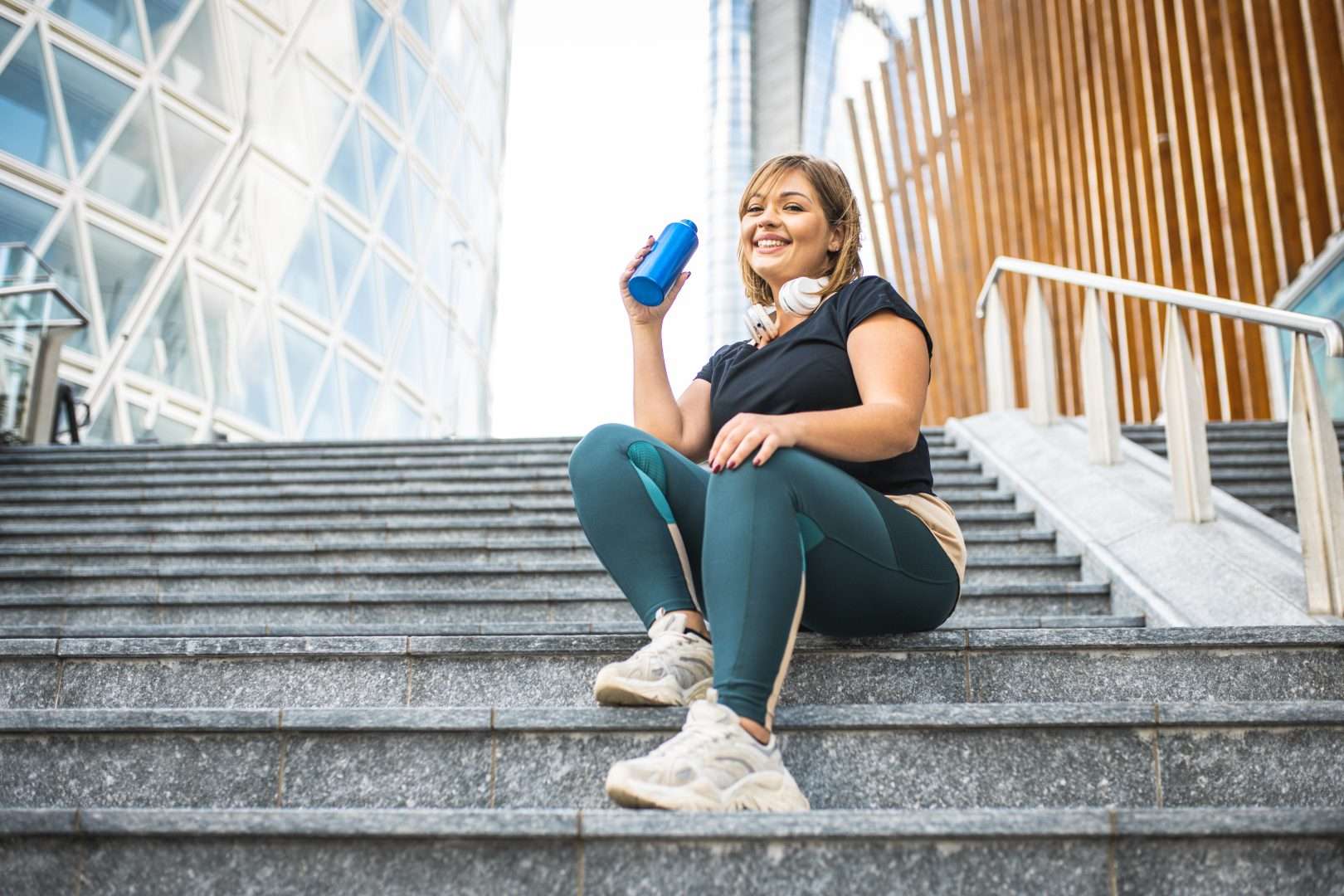 Lady sitting on steps going through Weight Loss Programs